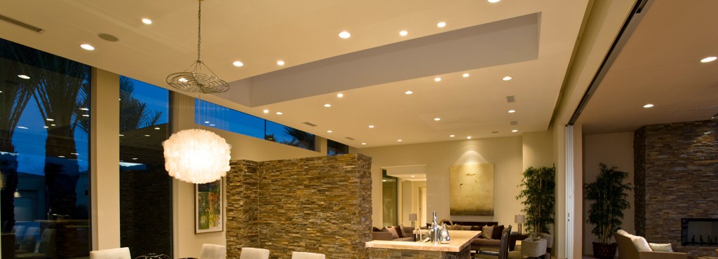 residential lighting with high hats and chandelier 