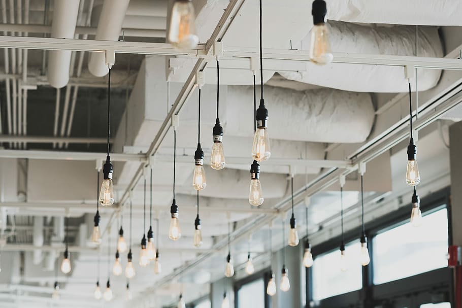 Pendant light bulbs hanging from a ceiling in commercial building