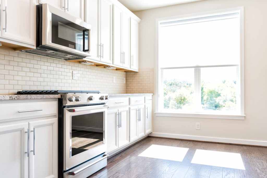 Modern gray, brown neutral kitchen features of kitchen appliances